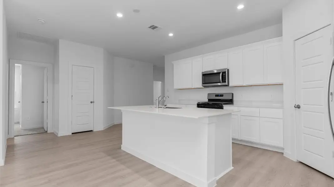 Furnished interior view inside a new home in Caldwell Crossing, Iowa Colony (Image 3). Furnished interior view inside a new home in Caldwell Crossing, Iowa Colony (Image 3).