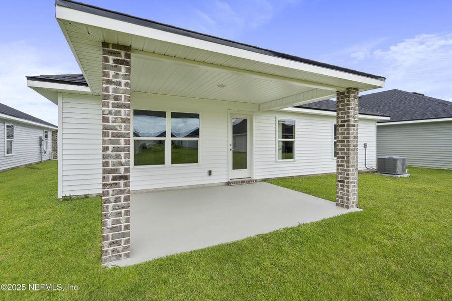 Front exterior of a new home in Summerglen, Jacksonville, FL, highlighting curb appeal (Image 13). Front exterior of a new home in Summerglen, Jacksonville, FL, highlighting curb appeal (Image 13).