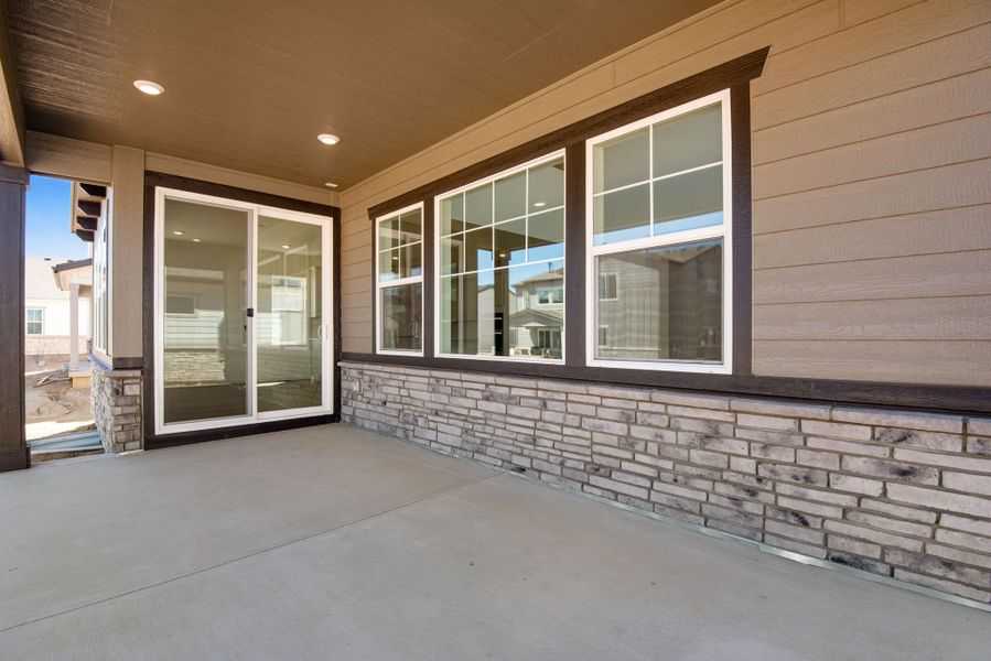 Exterior details and patio area of a home in The Aurora Highlands, Aurora (Image 28).