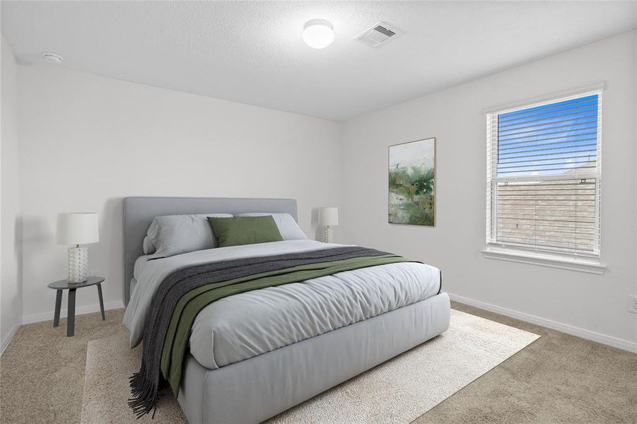 Secondary bedroom features plush carpet, neutral paint, lighting, large window with privacy blinds and ample sized closet space.