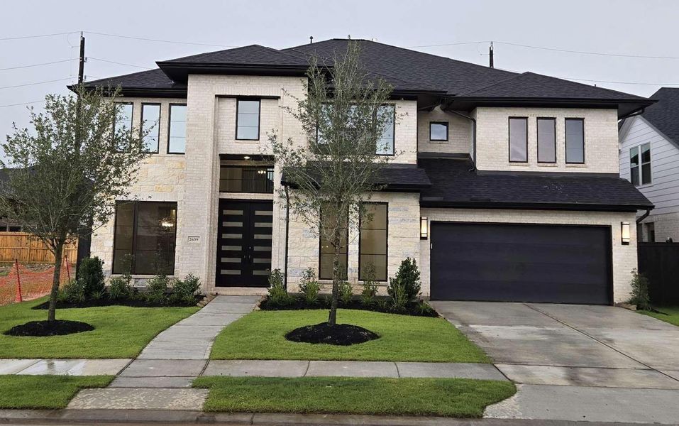 Front exterior of a new home in , Richmond, TX, highlighting curb appeal (Image 24).