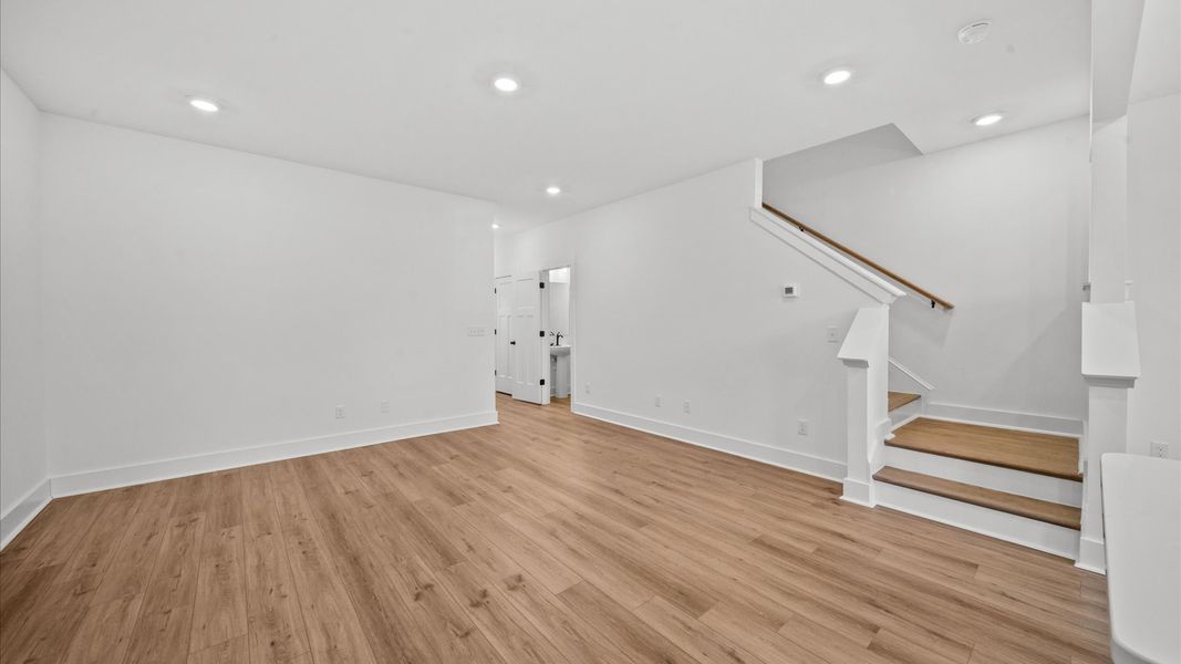 Vibrant kitchen layout with a center island, refined finishes, and open-concept flow at this townhome community in Arden, NC