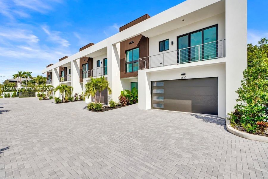Front exterior of a new home in , Dania Beach, FL, highlighting curb appeal (Image 27).