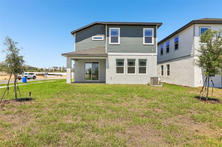 Exterior details and patio area of a home in Cyrene at Minneola - Villas, Montverde (Image 21).