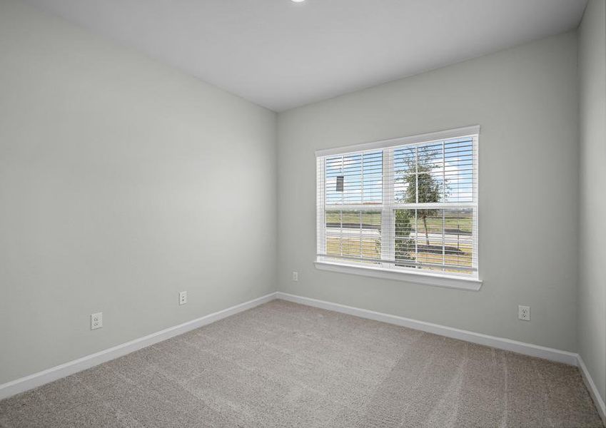 Secondary bedroom with carpet