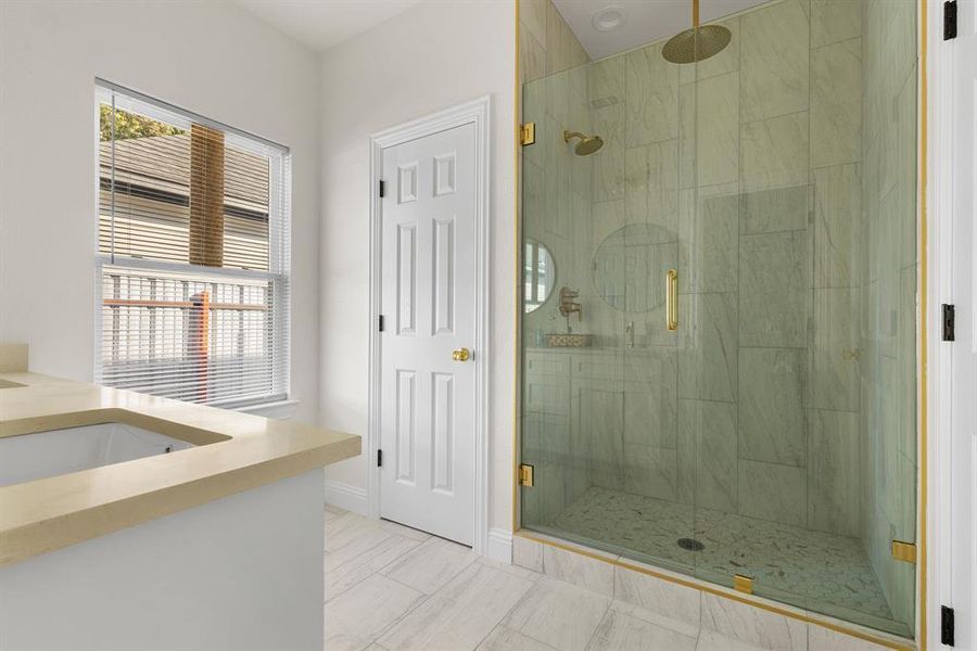 Bathroom featuring vanity and walk in shower