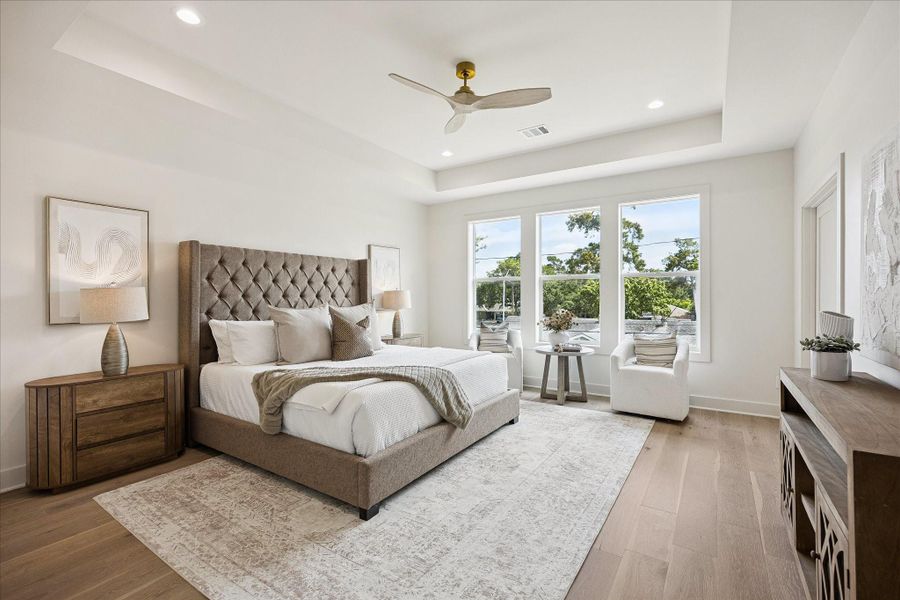 You’ll have sweet dreams in this posh owner’s retreat with a 10-foot tray ceiling, wide plank engineered white oak flooring, two custom walk-in closets and a luxurious ensuite bathroom.
