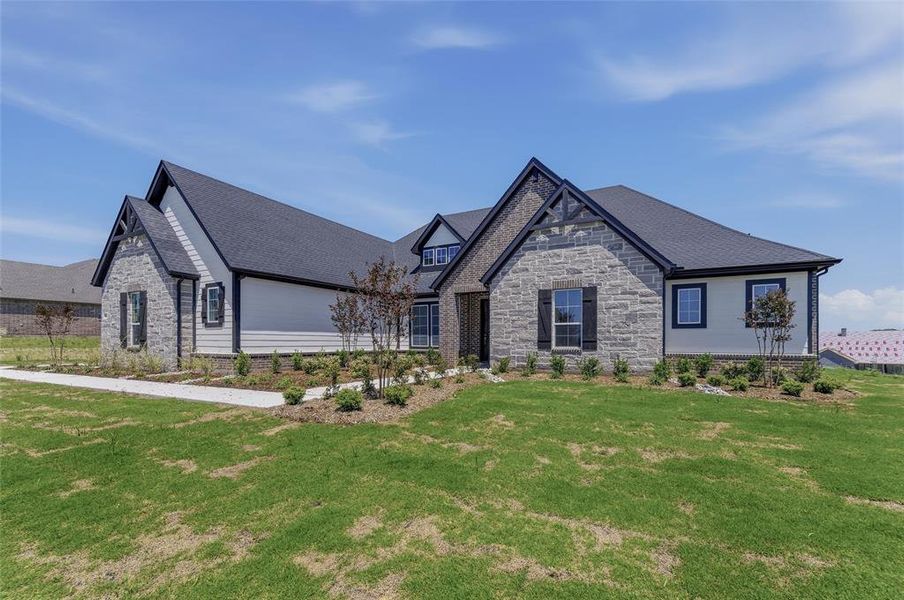 Single-story residence featuring a stone and siding facade with dark trim accents