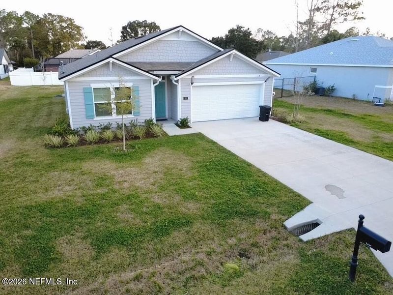 Front exterior of a new home in Palm Coast Homesites, Palm Coast, FL, highlighting curb appeal (Image 25).