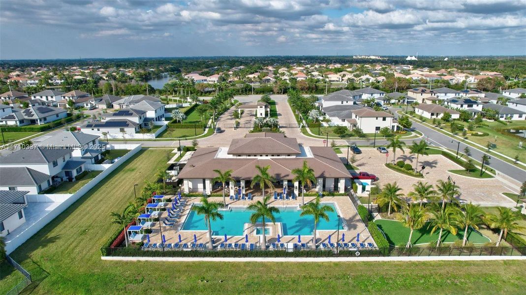 Brand New Luxury Clubhouse w/ Heated Lake Side Lap Pool with umbrellas and lounge chairs, Putting Green, Gym, Kitchen, Child Play Area and Party Spaces