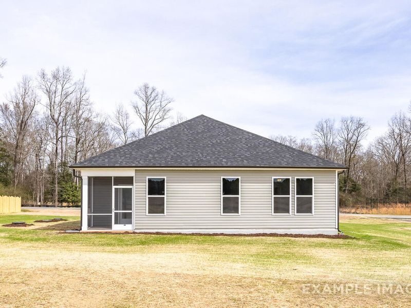 Front exterior of a new home in Woodland Crossing, Zebulon, NC, highlighting curb appeal (Image 1).