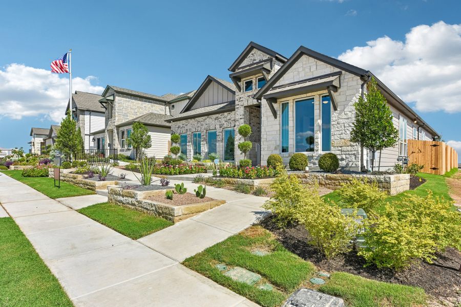 Representative exterior photo of a completed home built from the Enfield by Taylor Morrison in Village Grove, Dripping Springs, TX (Image 25).