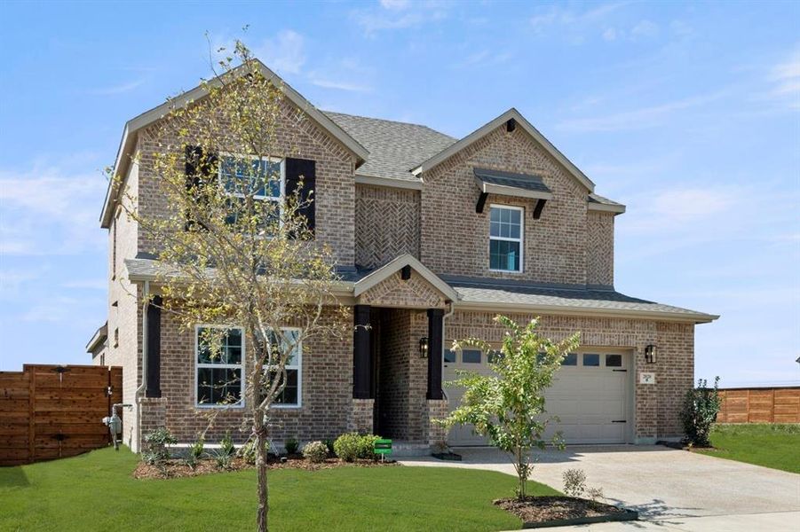 Front exterior of a new home in Solterra, Mesquite, TX, highlighting curb appeal (Image 2).