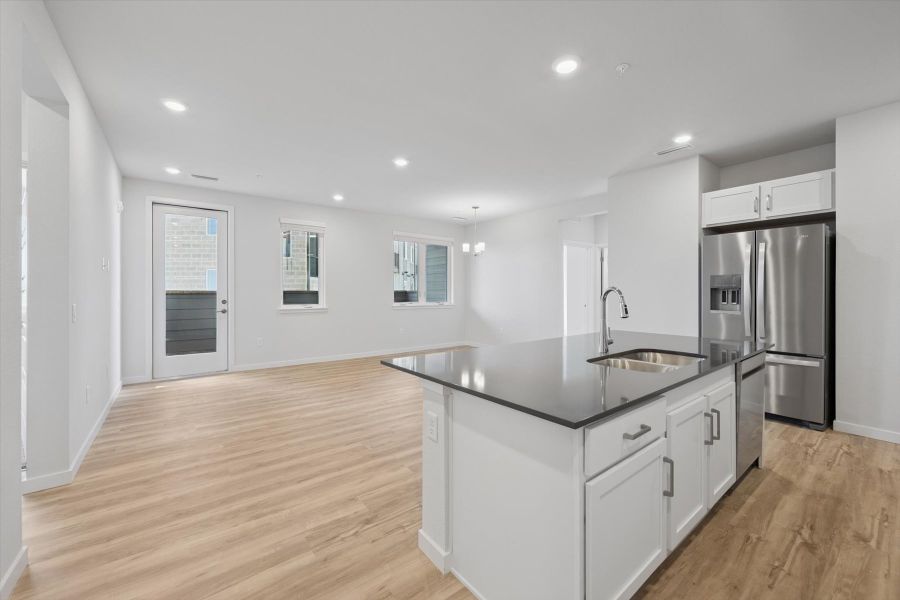 A kitchen with white cabinets. A kitchen with white cabinets.