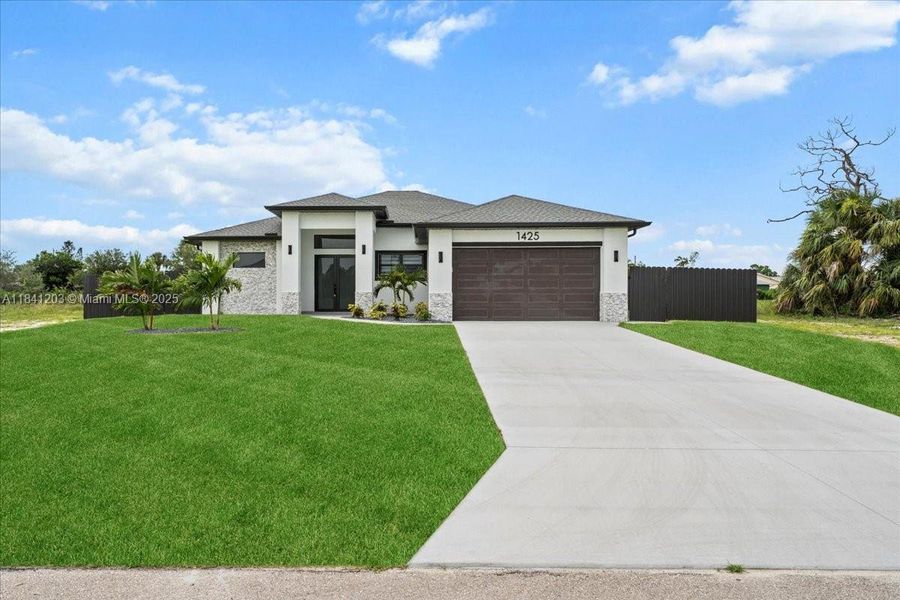 Front exterior of a new home in , Cape Coral, FL, highlighting curb appeal (Image 1). Front exterior of a new home in , Cape Coral, FL, highlighting curb appeal (Image 1).