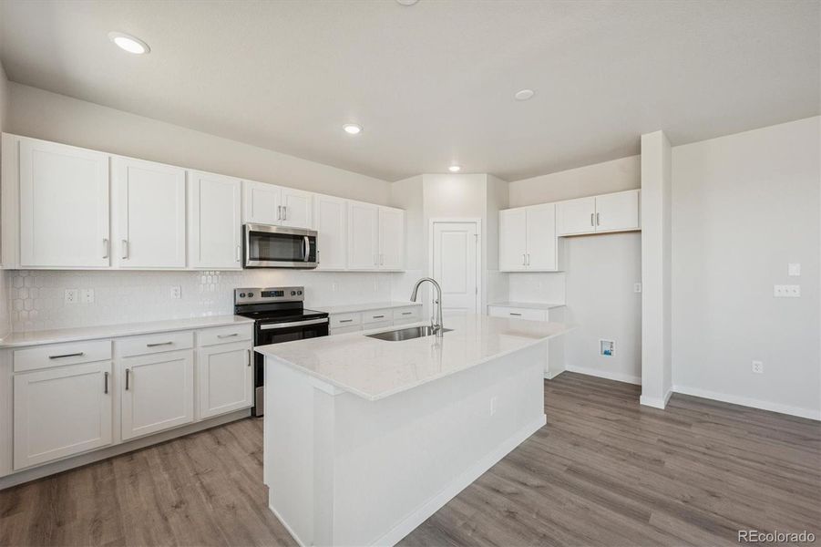 Furnished interior view inside a new home in The Aurora Highlands, Aurora (Image 4).