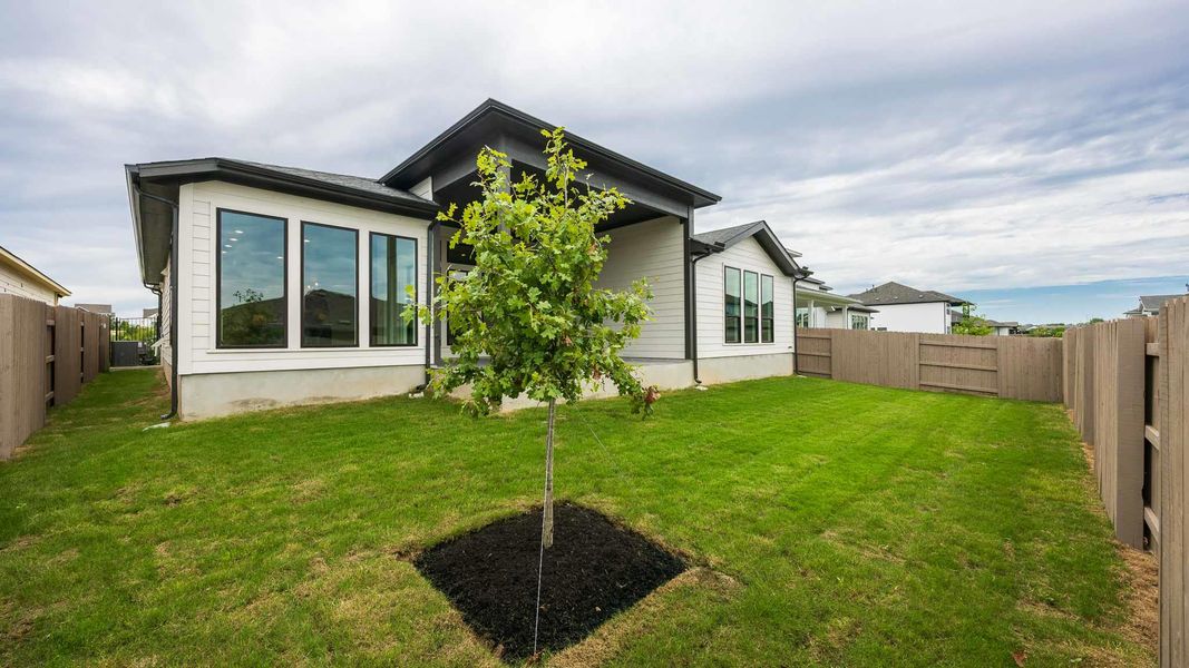 Rear view of house with a fenced backyard Rear view of house with a fenced backyard