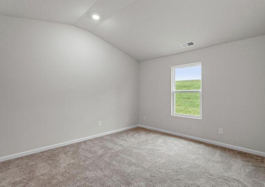 Master bedroom with carpet and a window.