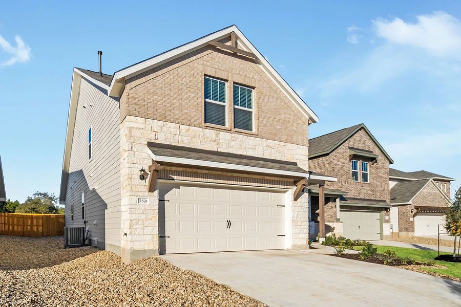 Representative exterior photo of a completed home built from the Granbury by Ashton Woods in The Trails at Carmel, Pflugerville, TX (Image 25).