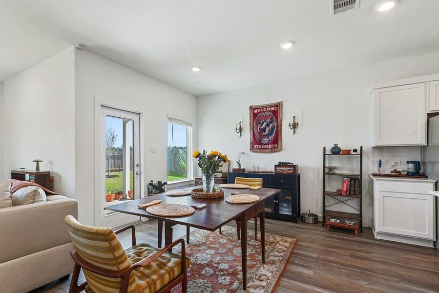 The breakfast area is filled with natural light and has a wonderful view of the back yard.