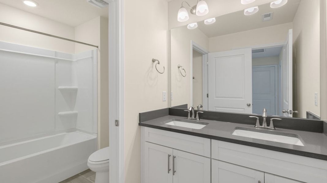 Furnished interior view inside a new home in Lybrook Village, Advance (Image 5).