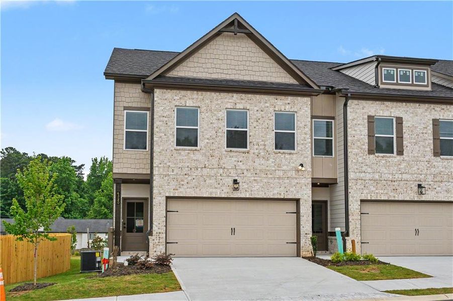 Front exterior of a new home in , Norcross, GA, highlighting curb appeal (Image 1). Front exterior of a new home in , Norcross, GA, highlighting curb appeal (Image 1).