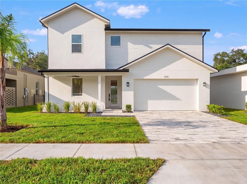 Front exterior of a new home in , Lady Lake, FL, highlighting curb appeal (Image 2). Front exterior of a new home in , Lady Lake, FL, highlighting curb appeal (Image 2).