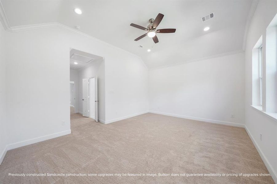 Primary Bedroom Serenity – This alternate view highlights the spacious layout and natural light that make this primary suite the perfect place to relax and recharge.