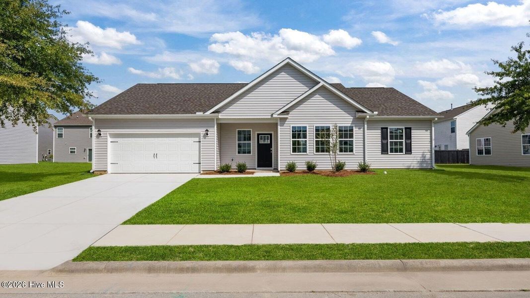 Front exterior of a new home in Tyler - Home on the Lake, New Bern, NC, highlighting curb appeal (Image 1). Front exterior of a new home in Tyler - Home on the Lake, New Bern, NC, highlighting curb appeal (Image 1).