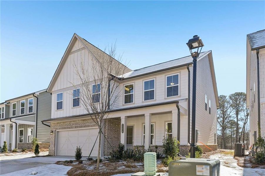 Front exterior of a new home in Arbors at Richland Creek, Buford, GA, highlighting curb appeal (Image 2). Front exterior of a new home in Arbors at Richland Creek, Buford, GA, highlighting curb appeal (Image 2).