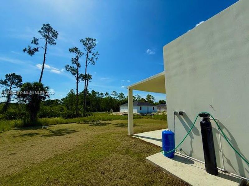 Front exterior of a new home in , Lehigh Acres, FL, highlighting curb appeal (Image 8).