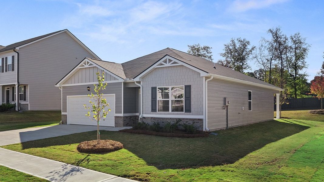 Front exterior of a new home in Champion's Run, Lithonia, GA, highlighting curb appeal (Image 2).