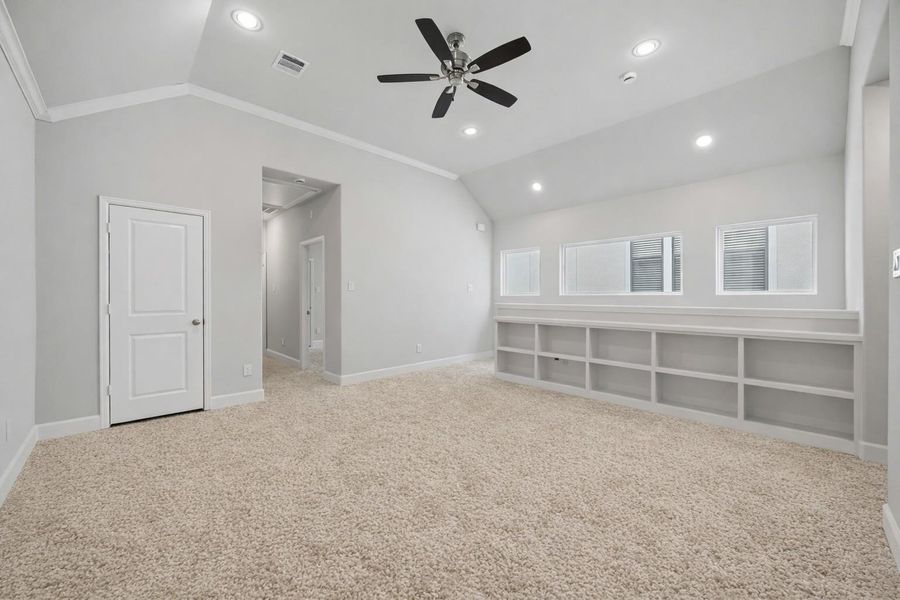 Perched at the top of the stairs, this upstairs lounge is a choose-your-own-adventure space—cozy TV den, home office, or creative corner. The vibe? Totally relaxed.