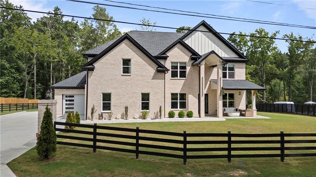 Front exterior of a new home in , Lawrenceville, GA, highlighting curb appeal (Image 25).