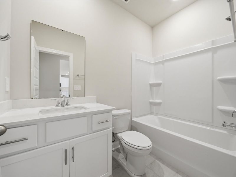 Furnished interior view inside a new home in The Farm at Wells Creek - Signature Collection, Gray Court (Image 8).