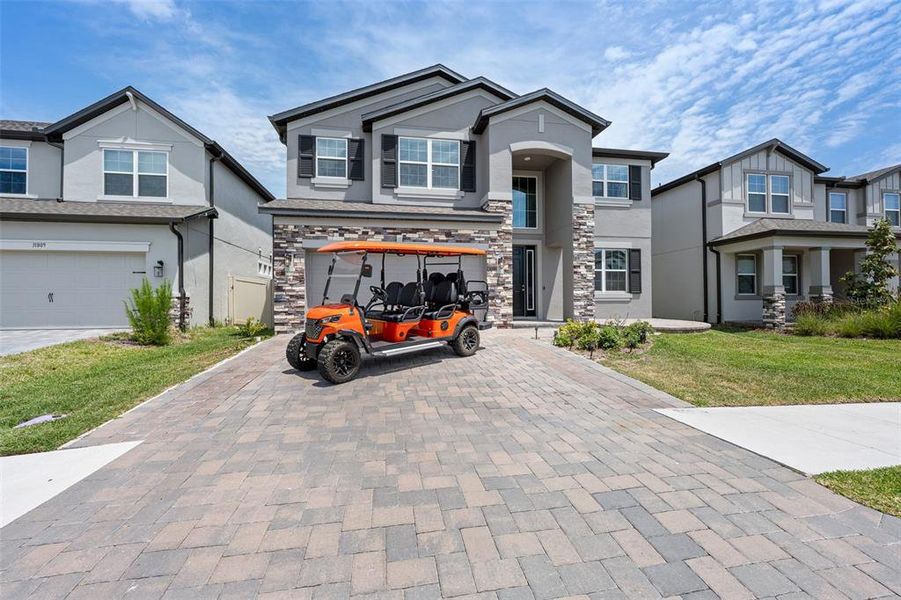 Front exterior of a new home in Epperson, Wesley Chapel, FL, highlighting curb appeal (Image 1). Front exterior of a new home in Epperson, Wesley Chapel, FL, highlighting curb appeal (Image 1).