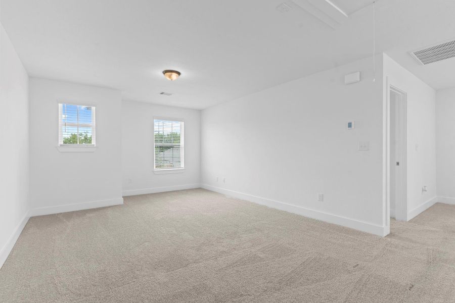 A second angle of the upstairs game room reveals its expansive footprint and versatility—perfect for entertaining, relaxing, or creating a fun hangout zone for all ages. **Image Representative of Plan Only and May Vary as Built**. A second angle of the upstairs game room reveals its expansive footprint and versatility—perfect for entertaining, relaxing, or creating a fun hangout zone for all ages. **Image Representative of Plan Only and May Vary as Built**.