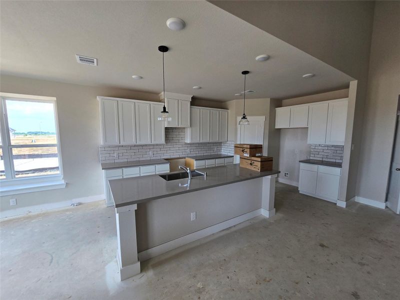 The open layout invites laughter and warmth, making it the perfect backdrop for family gatherings or cozy brunches with friends.