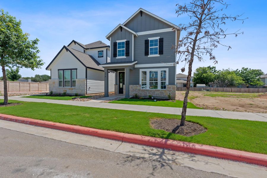 Craftsman-style house featuring board and batten siding and stone siding