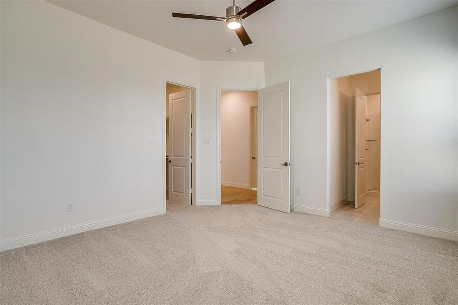 large 3rd bedroom with large walk in closet, ceiling fan