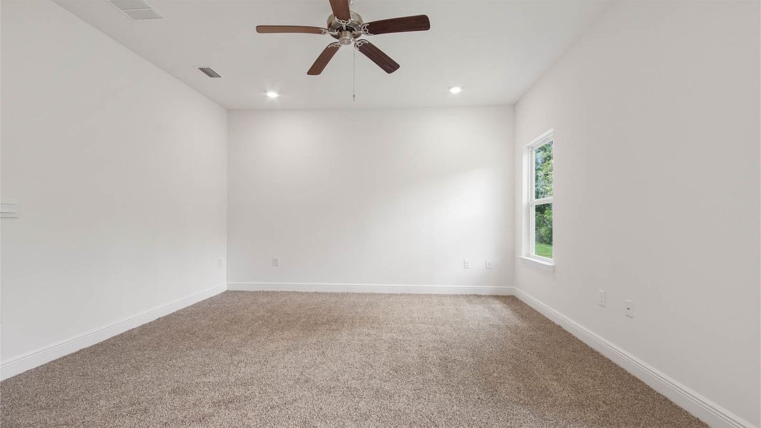 Representative unfurnished interior of a home built from the Kennedy by D.R. Horton in Bayside at Ward Creek, Panama City Beach (Image 25).