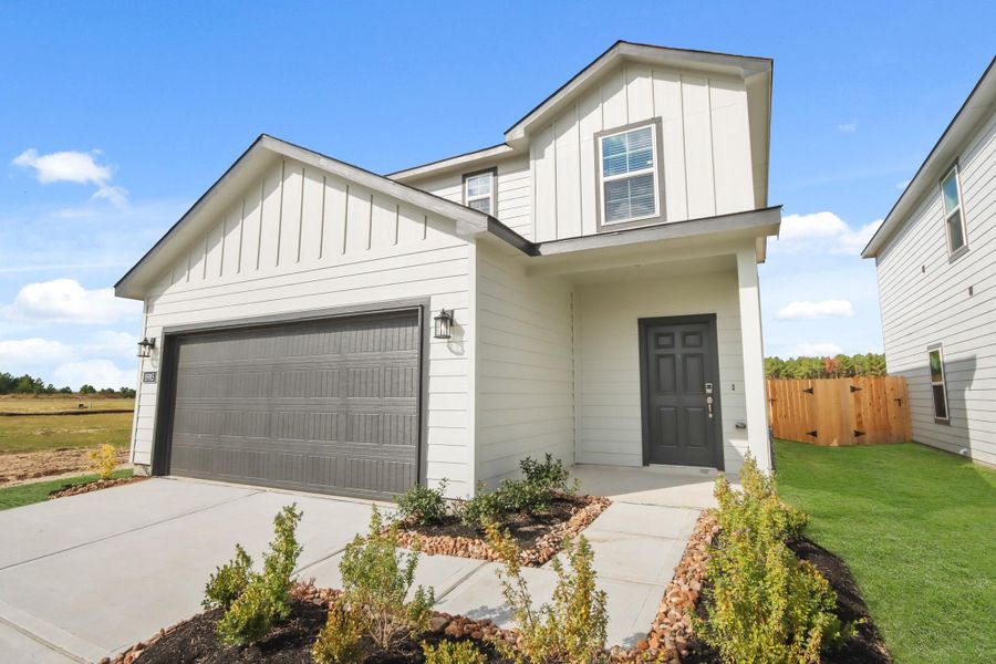 Front exterior of a new home in Northpark South, Porter, TX, highlighting curb appeal (Image 17). Front exterior of a new home in Northpark South, Porter, TX, highlighting curb appeal (Image 17).