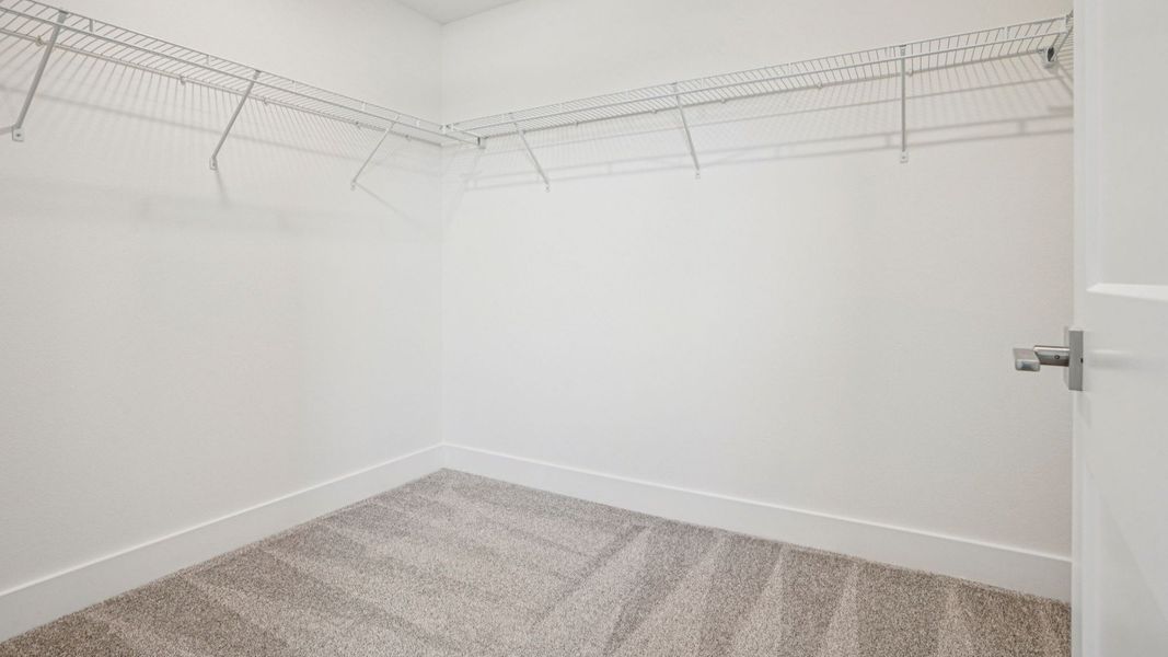 Plumeria Floor Plan primary suite walk-in closet by DRB Homes in Trailside located in Mount Dora, FL Plumeria Floor Plan primary suite walk-in closet by DRB Homes in Trailside located in Mount Dora, FL