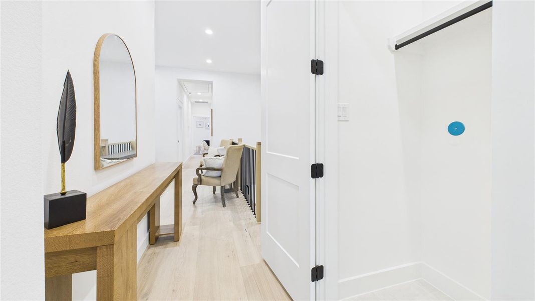 Hallway leading to the utility closet and the primary bedroom!