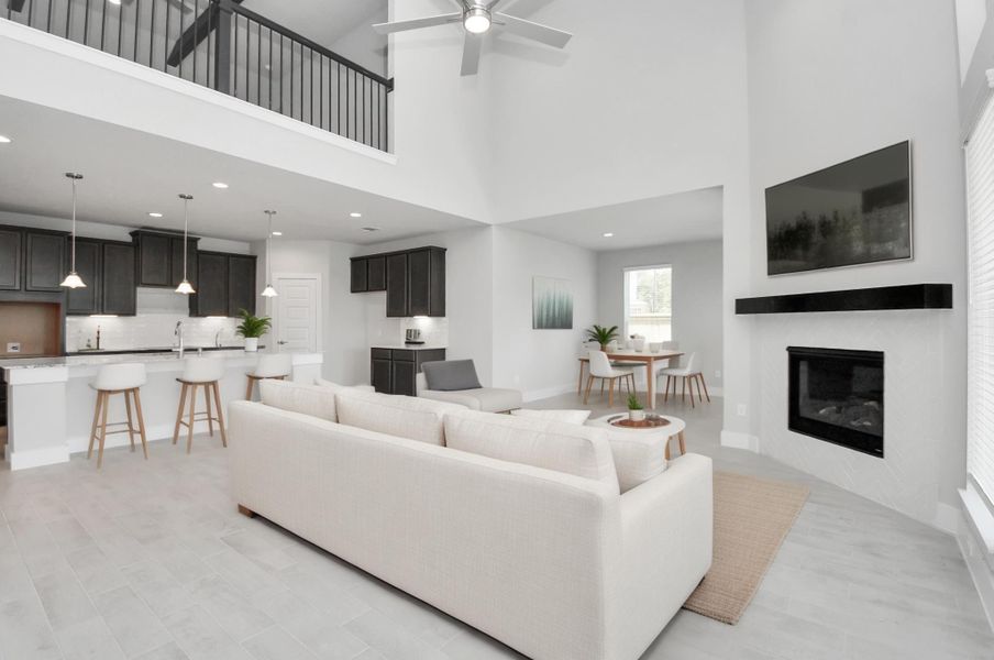 Virtual Staged. Gather the family and guests together in your lovely living room! Featuring soaring high ceilings, recessed lighting, ceiling fan, custom paint, gorgeous floors, and large windows that provide plenty of natural lighting throughout the day. Sample photo of completed home with similar floor plan. Actual colors and selections may vary. Virtual Staged. Gather the family and guests together in your lovely living room! Featuring soaring high ceilings, recessed lighting, ceiling fan, custom paint, gorgeous floors, and large windows that provide plenty of natural lighting throughout the day. Sample photo of completed home with similar floor plan. Actual colors and selections may vary.