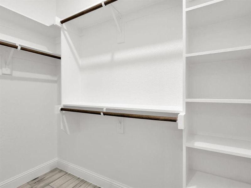 Walk in closet featuring light hardwood / wood-style flooring