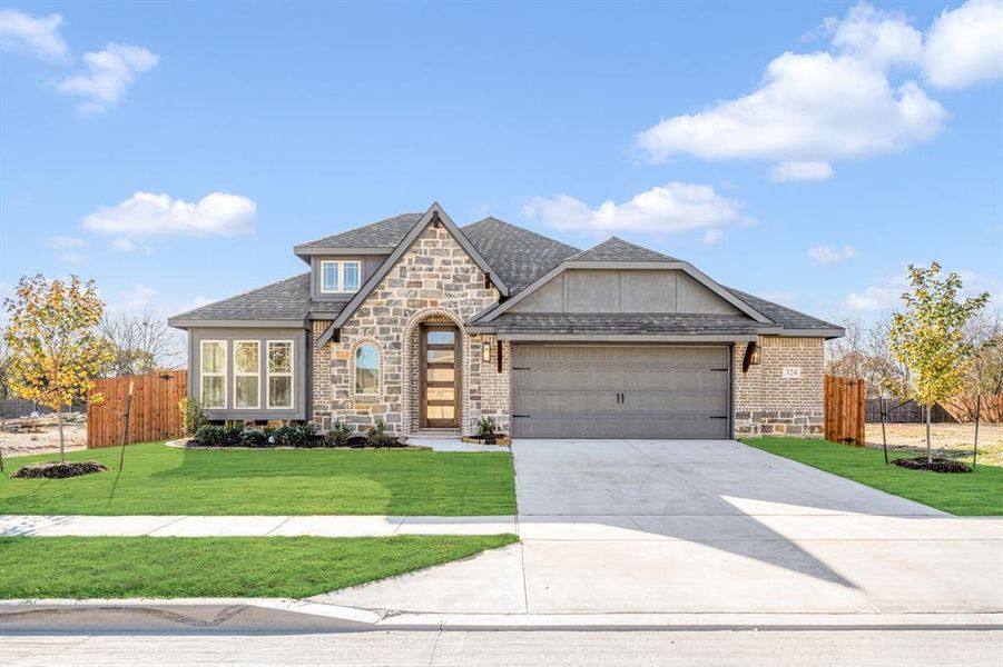 Front exterior of a new home in Maplewood, Glenn Heights, TX, highlighting curb appeal (Image 2).
