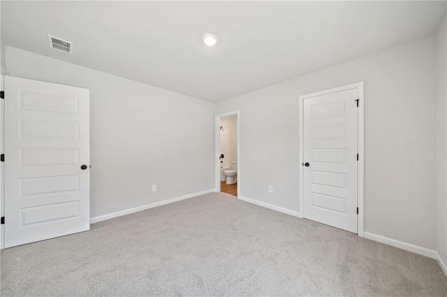 Spacious, unfurnished interior of a new home in Vines at Mill Creek - Estate Series, Braselton (Image 29).