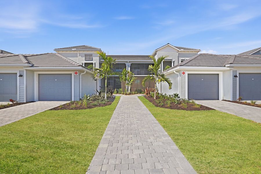 Front exterior of a new home in Webbs Reserve at Babcock Ranch, Punta Gorda, FL, highlighting curb appeal (Image 1). Front exterior of a new home in Webbs Reserve at Babcock Ranch, Punta Gorda, FL, highlighting curb appeal (Image 1).