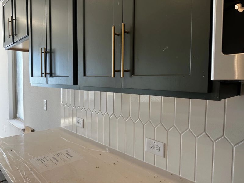 In-progress construction of a new home in Sunterra, Katy, TX (Image 26).